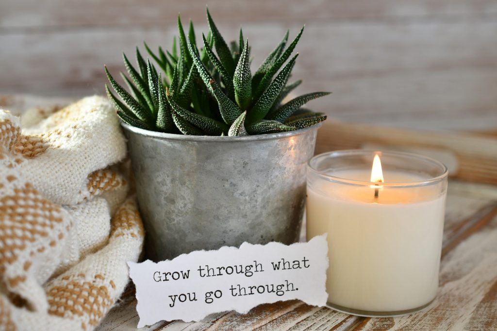 Sign reading ‘Grow through what you go through’
